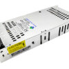 Metal enclosed DC power supply with vented panels, a 5-terminal block on the left, and a yellow CAUTION sticker.