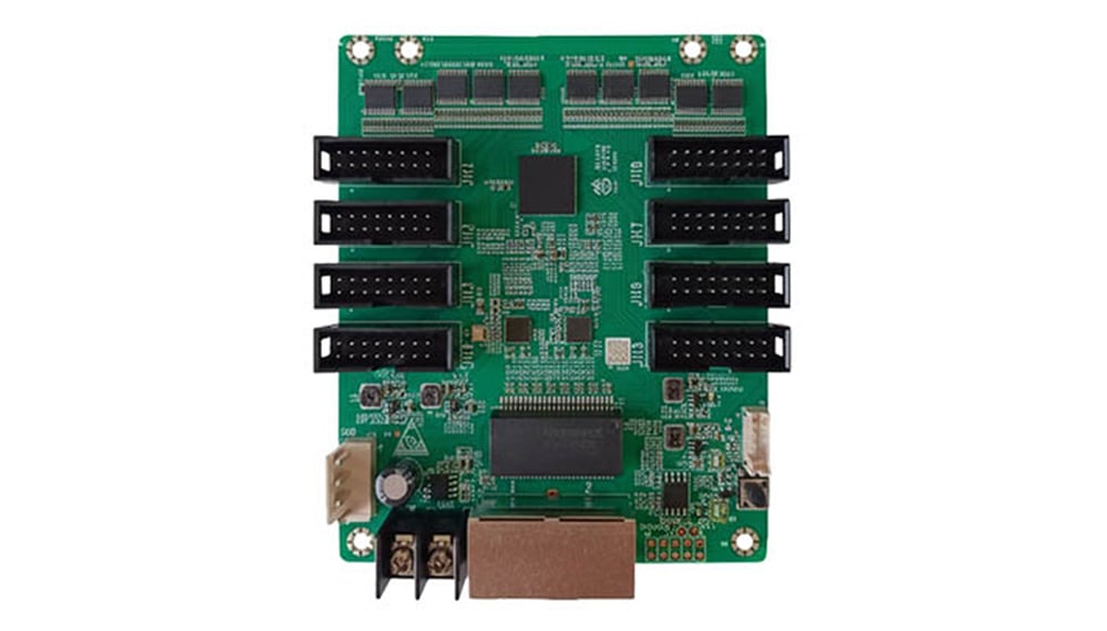 Green computer expansion card with eight black connector slots in two columns on a PCB, plus power and edge connectors at the bottom.